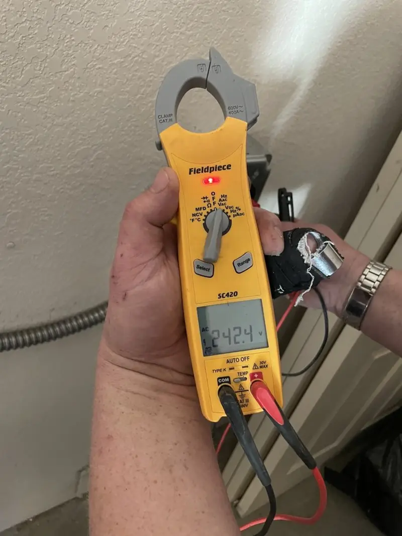 Voltage testing with clamp meter during Aluminum Wiring Replacement in Clarkson